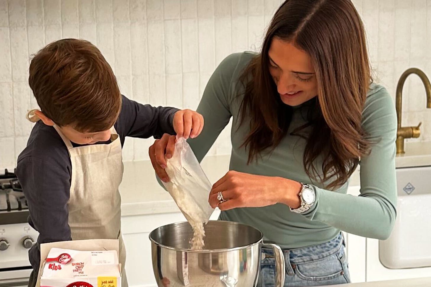 Mum and child baking in the kitchen.